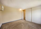 Thumbnail 30 of 33 - a bedroom with white walls and a carpeted floor at Broadmoor Springs, Colorado Springs, CO, 80906