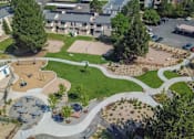 Thumbnail 35 of 45 - an aerial view of a park with a skate park at Spyglass Creek, Denver, 80224