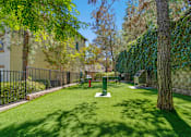 Thumbnail 50 of 65 - A green lawn with a tree and a red fire hydrant.