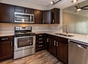 Thumbnail 1 of 37 - diamond kitchen with dark wood cabinets and modern appliances
