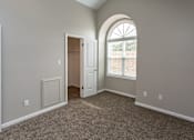 Thumbnail 3 of 37 - diamond bedroom with arched window and walk-in closet