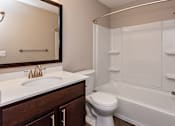 Thumbnail 7 of 37 - bathroom with tub, toliet, and large vanity