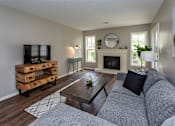Thumbnail 9 of 37 - living room with fireplace, paneled windows, and comfortable furniture