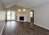Thumbnail 2 of 37 - living room space with vaulted ceilings, fireplace and bright light