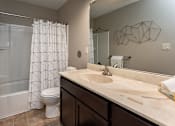 Thumbnail 12 of 37 - bathroom with tub and large cabinet spaces