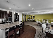 Thumbnail 19 of 27 - a business area with two desks and computers and a kitchenette area with high-top seating