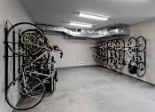 Thumbnail 27 of 27 - a bike storage facility with several bikes hanging vertically