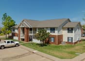 Thumbnail 3 of 30 - an apartment building with a truck parked in front of it at Chapel Ridge of Stillwater, Stillwater, OK, 74075