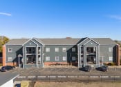 Thumbnail 12 of 39 - an aerial view of an apartment building with a parking lot at Emerald Greens, Norman