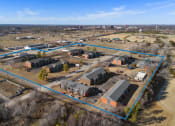 Thumbnail 3 of 39 - a birdseye view of a neighborhood of houses and a city in the background at Emerald Greens, Norman, 73072