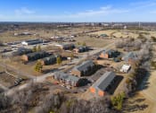 Thumbnail 6 of 39 - an aerial view of a neighborhood with houses and a city in the background at Emerald Greens, Oklahoma