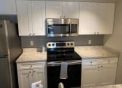 Thumbnail 14 of 18 - Stainless Steel Appliances at Auburn Glen Apartments, Jacksonville, FL, 32256