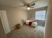 Thumbnail 17 of 18 - Bedroom With Ceiling Fan at Auburn Glen Apartments, Jacksonville, Florida