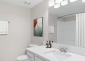 Thumbnail 17 of 17 - a white bathroom with a sink and a mirror at Lakeside Villas, Orlando, 32817