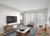 Thumbnail 12 of 17 - a living room with a couch and a television at Lakeside Villas, Orlando, FL 32817