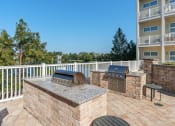 Thumbnail 11 of 51 - barbecue grill and seating area at Lake Lofts at Deerwood, Florida, 32216