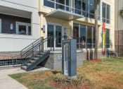 Thumbnail 5 of 51 - the front of a building with a sign in front of itat Lake Lofts at Deerwood, Jacksonville, FL