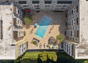 Thumbnail 4 of 51 - an aerial view of an apartment building with a swimming poolat Lake Lofts at Deerwood, Florida, 32216