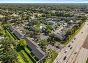 Thumbnail 17 of 21 - an aerial view of a neighborhood with cars parked in a parking lot at Oak Reserve at Winter Park, Winter Park, FL