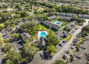 Thumbnail 16 of 21 - a view of a pool from above in a parking lot at Oak Reserve at Winter Park, Winter Park, FL, 32792