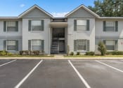 Thumbnail 3 of 21 - an empty parking lot in front of an apartment building at Oak Reserve at Winter Park, Florida, 32792