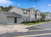 Thumbnail 20 of 21 - a white house with a street and a parking lot at Oak Reserve at Winter Park, Winter Park, 32792