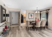 Thumbnail 6 of 21 - the living room and dining room of a home with a table and chairs at Oak Reserve at Winter Park, Florida