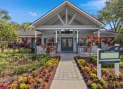 Thumbnail 4 of 21 - the entrance to a building with a sign in front of it at Oak Reserve at Winter Park, Florida