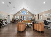 Thumbnail 13 of 21 - the lobby of a clubhouse with couches and chairs at Oak Reserve at Winter Park, Winter Park
