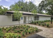 Thumbnail 20 of 54 - a white house with a garden in front of it  at Club at Emerald Waters, Hollywood, Florida