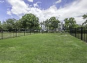 Thumbnail 21 of 54 - a large grassy area with a fence around it  at Club at Emerald Waters, Florida