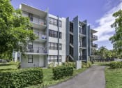 Thumbnail 3 of 54 - an image of an apartment complex with trees in the background  at Club at Emerald Waters, Florida, 33021
