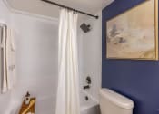 Thumbnail 53 of 54 - a bathroom with blue walls and a white shower curtain  at Club at Emerald Waters, Florida