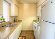 Thumbnail 8 of 18 - Fully Equipped Kitchen at Auburn Glen Apartments, Florida