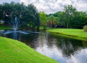 Thumbnail 5 of 18 - Lake With Fountain at Auburn Glen Apartments, Florida, 32256