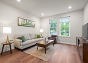 Thumbnail 3 of 17 - a living room with a couch and a coffee table