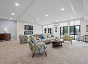 Thumbnail 11 of 17 - community room with couches and chairs