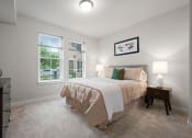 Thumbnail 6 of 17 - a bedroom with a bed and two windows