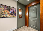 Thumbnail 38 of 59 - A painting of a woman in a forest is on the wall.