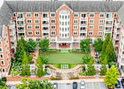 Thumbnail 1 of 59 - A large brick building with a courtyard in the middle.