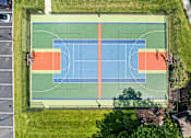 Thumbnail 34 of 64 - A basketball court with a blue and orange color scheme.