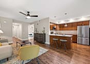 Thumbnail 2 of 30 - A modern kitchen with a wooden island and stainless steel appliances.