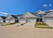 Thumbnail 1 of 33 - a row of houses in a neighborhood with a blue sky at The Prairie Villas, Dardenne Prairie, 63368