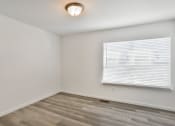 Thumbnail 14 of 33 - the living room of an apartment with a window and wood flooring at The Prairie Villas, Dardenne Prairie Missouri