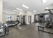 Thumbnail 11 of 28 - the gym is equipped with weights and cardio equipment at the flats at west end apartments at The Junction at Rogers, Rogers, AR