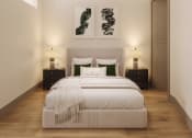 Thumbnail 29 of 58 - a bedroom with a bed and two paintings on the wall at Bemiston Place Apartments, Clayton, 63105