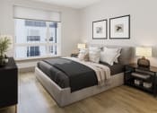 Thumbnail 23 of 58 - a bedroom with a bed and two windows at Bemiston Place Apartments, Clayton Missouri