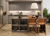 Thumbnail 22 of 58 - a kitchen with a large island with a table and chairs at Bemiston Place Apartments, Clayton, 63105