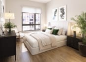 Thumbnail 58 of 58 - a white bedroom with a large bed and a window at Bemiston Place Apartments, Missouri