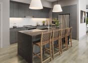 Thumbnail 40 of 58 - a kitchen with a large island and chairs in a house at Bemiston Place Apartments, Missouri, 63105